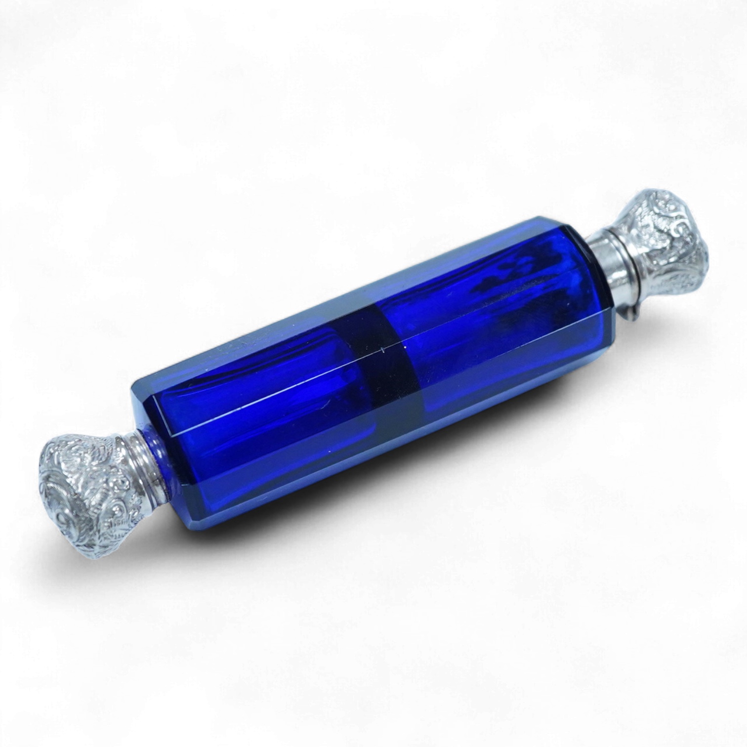 A late 19th century white metal mounted decagonal blue glass double ended scent bottle, 12.8cm.